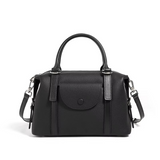 Black handbag with a strap on a white background