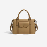 Beige handbag with a strap on a white background