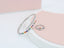 A ring set with a bracelet made of zircon stones