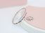A ring set with a bracelet made of zircon stones