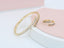 A ring set with a bracelet made of zircon stones